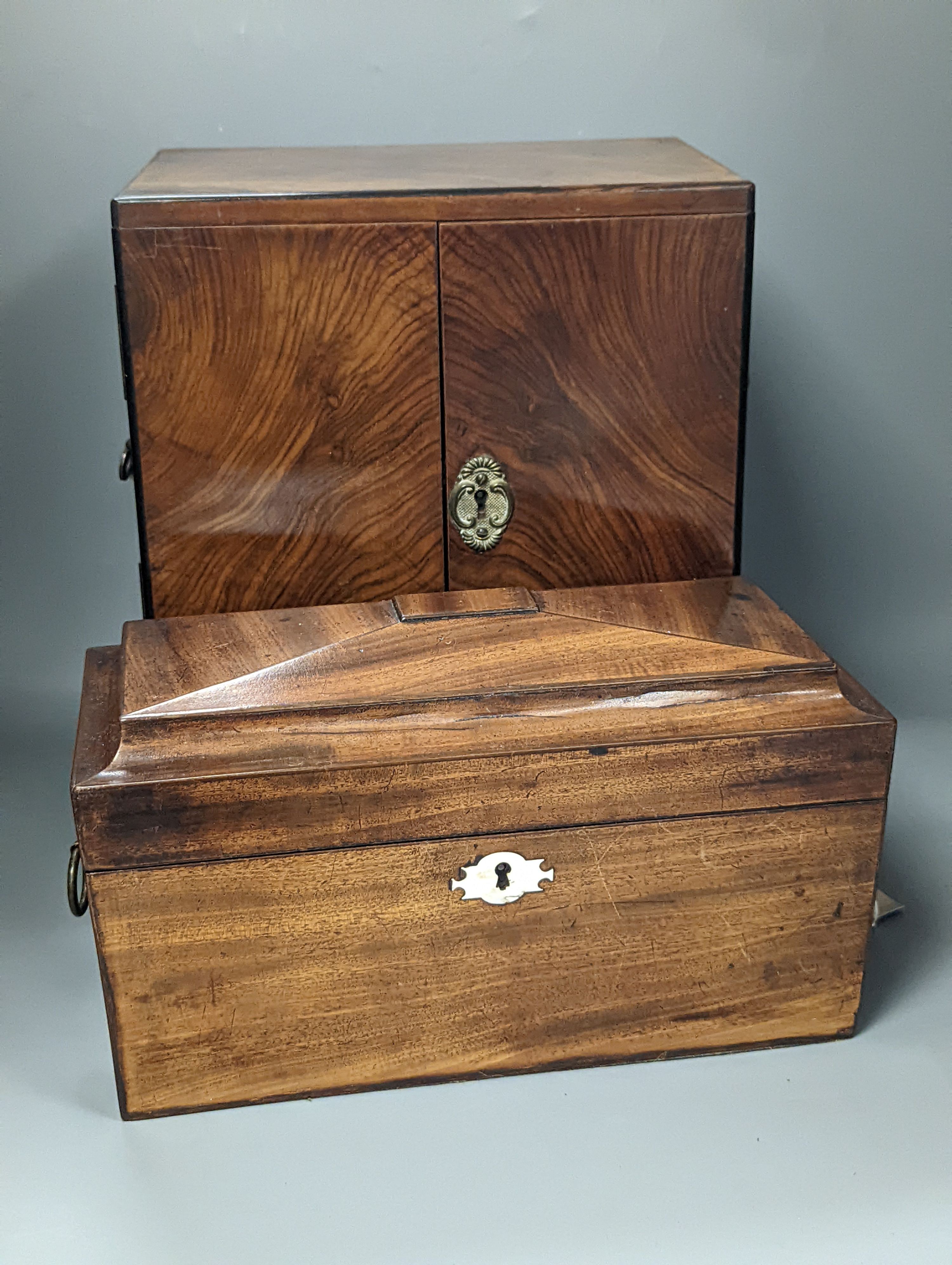 A 19th century mahogany tea caddy and a walnut 2 door smokers cabinet, Smokers cabinet 33 cms high.